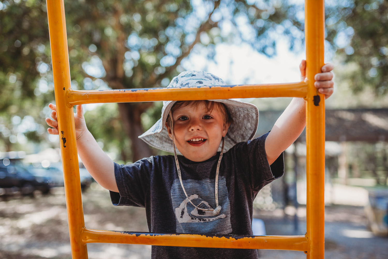 Newcastle family photographer beach summer holiday kids fun at playground