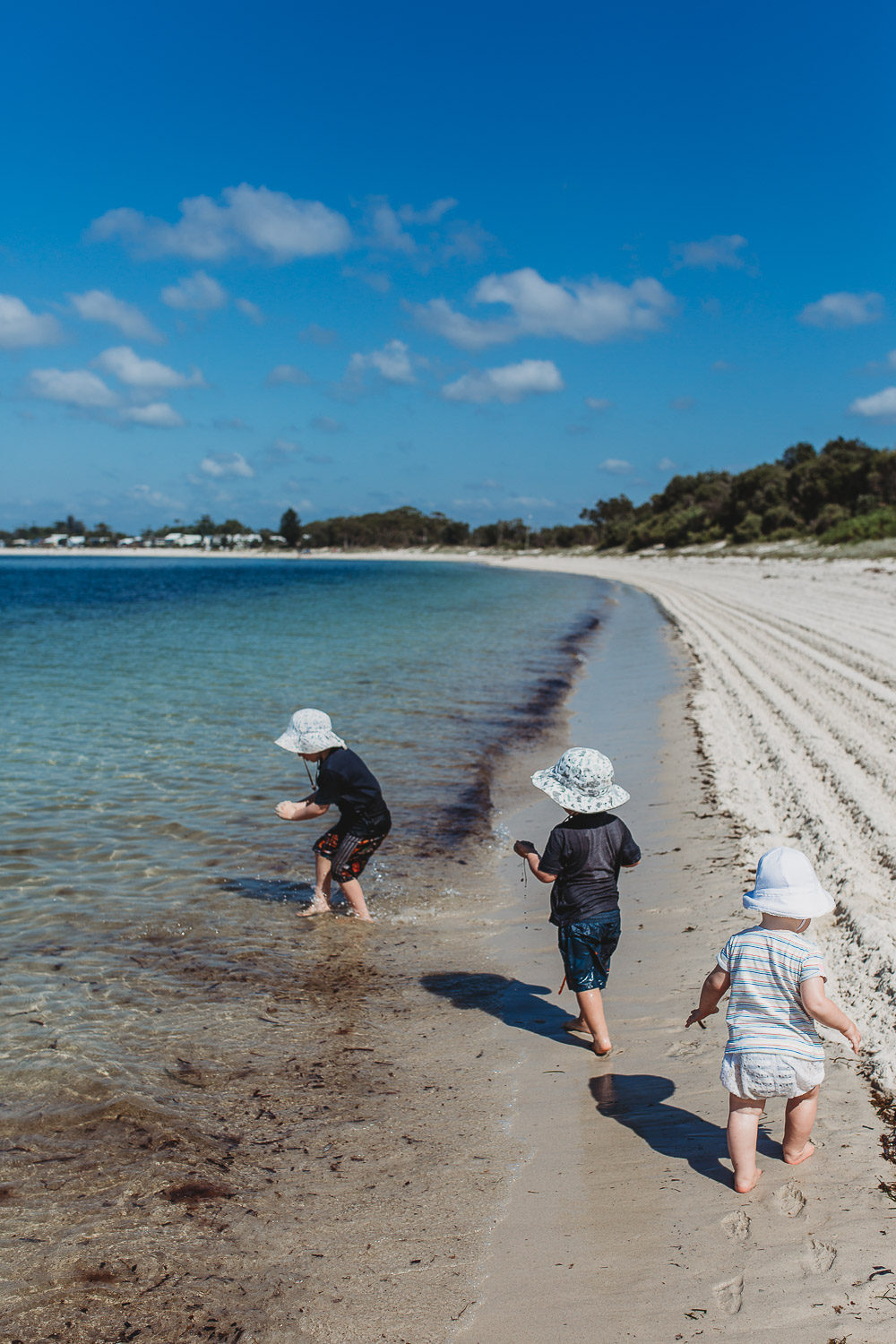 Newcastle family photographer beach summer holiday kids fun at playground