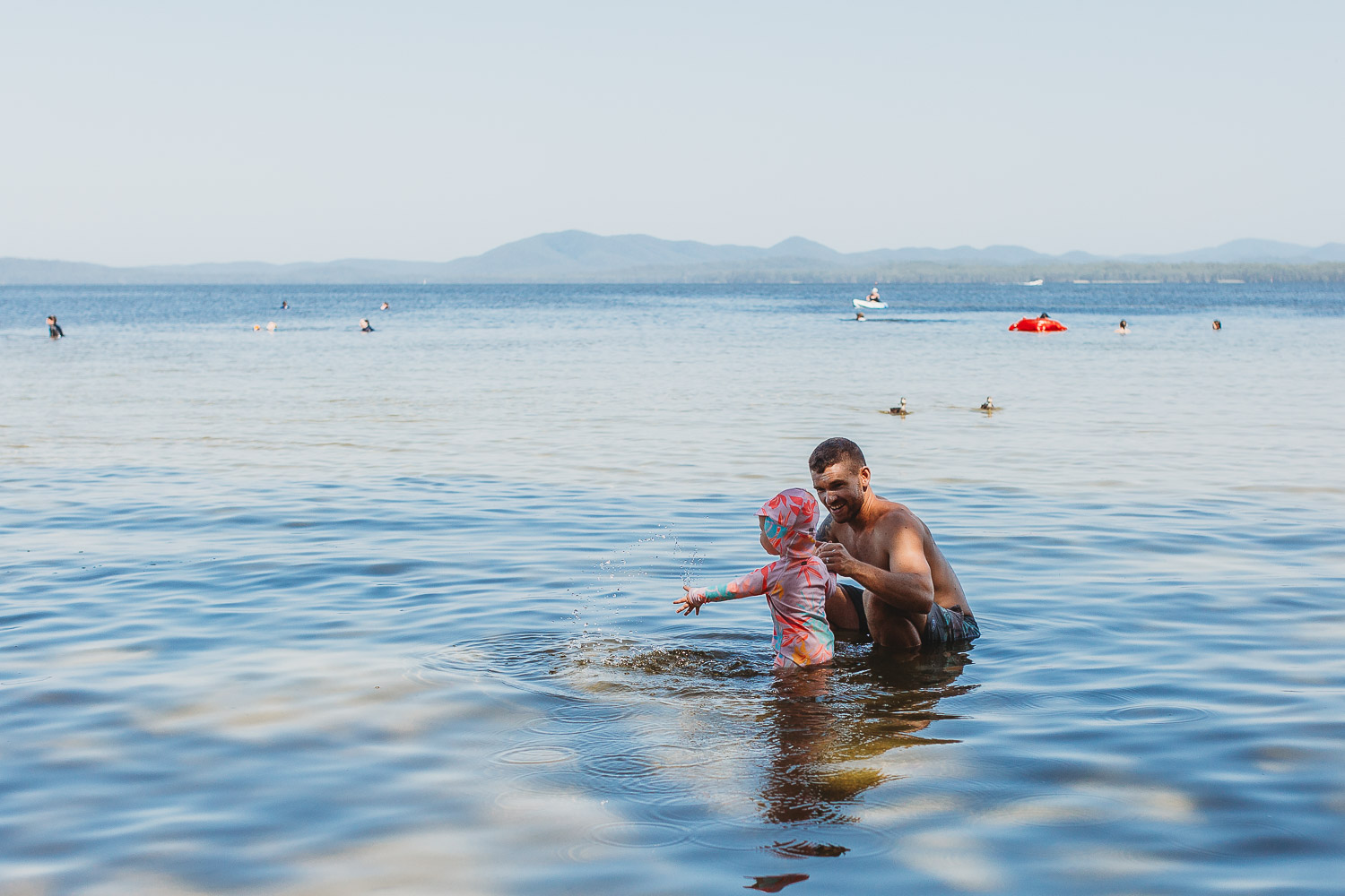 Newcastle family photographer beach summer holiday kids fun at playground