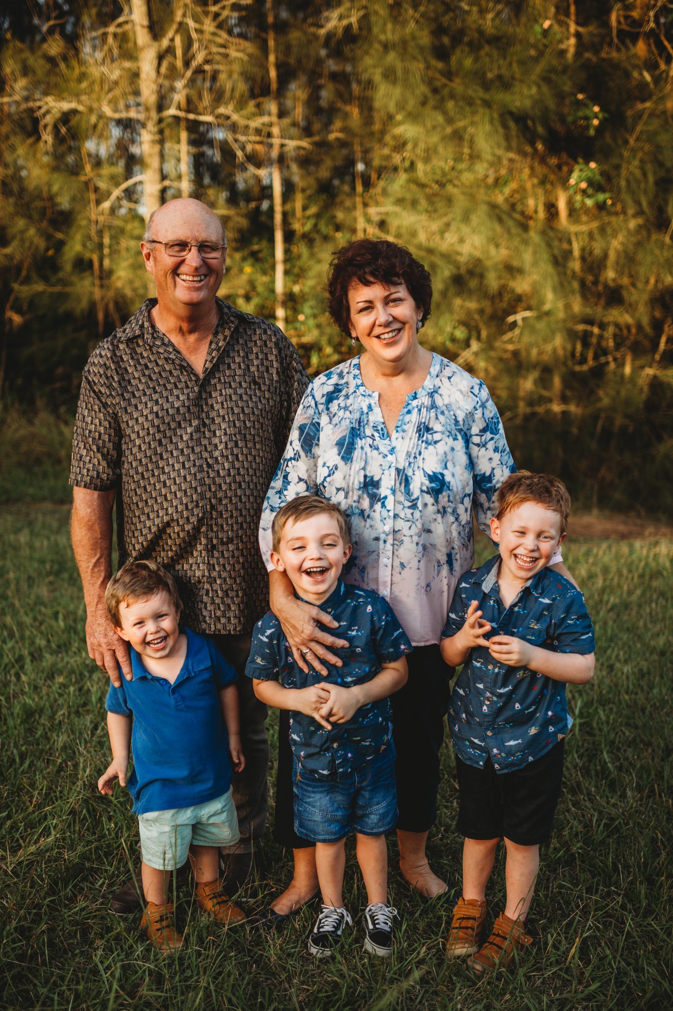 Grandparents and three grandsons smiling