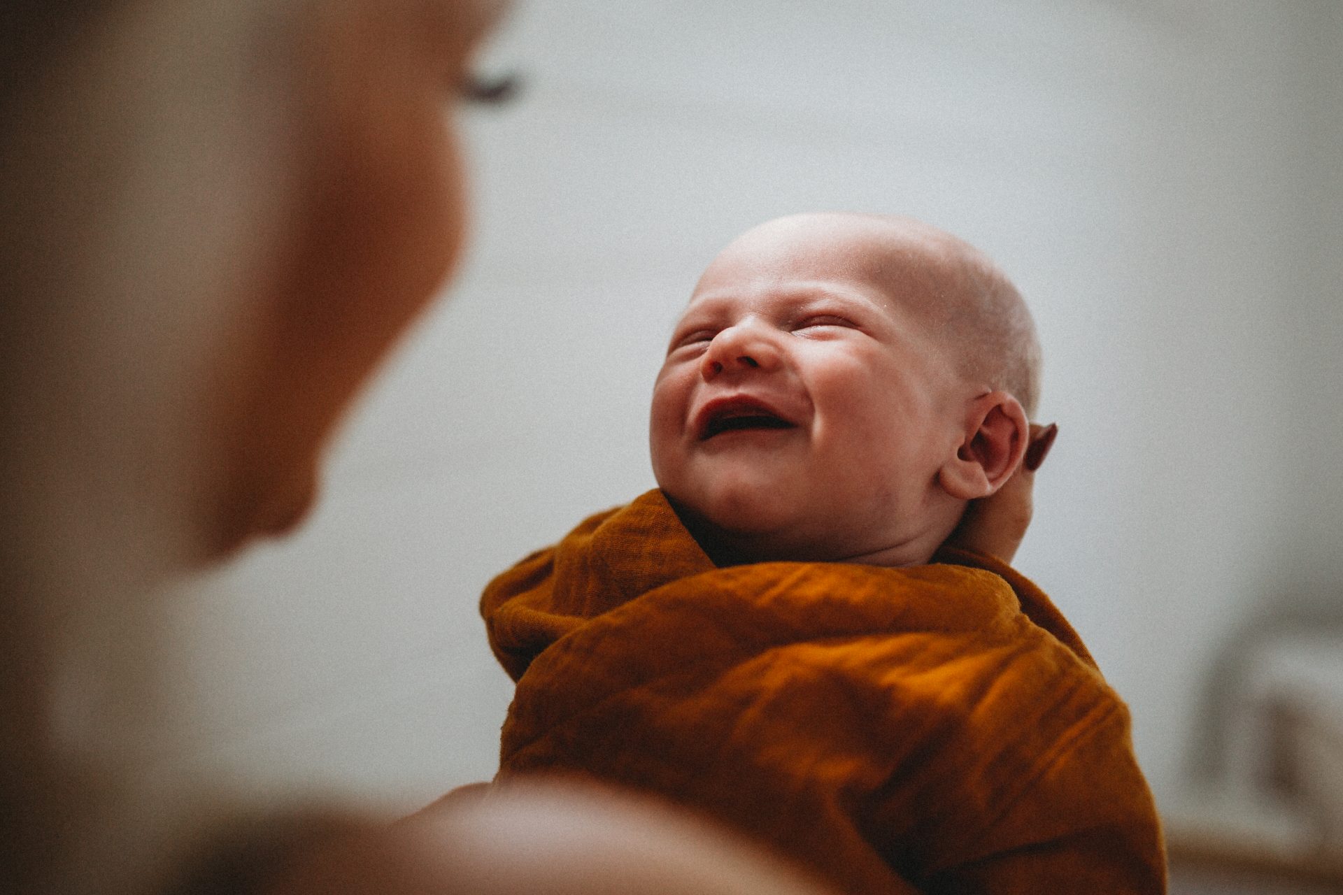 Baby smiling at mother